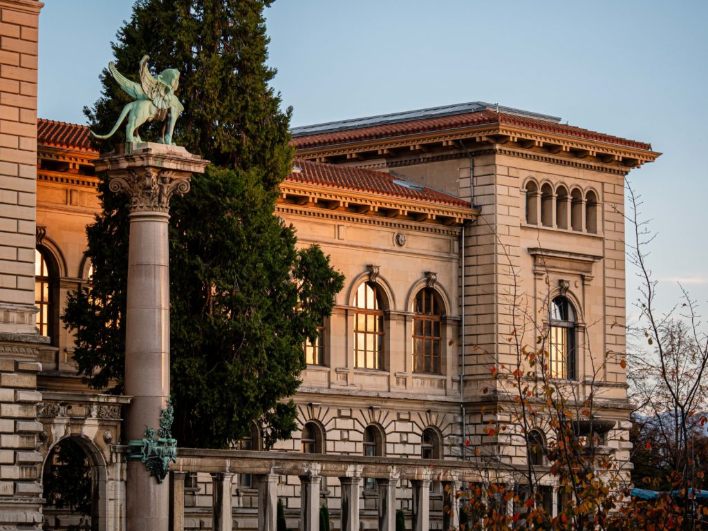 The Palais de Rumine in Lausanne, late sunlight brushing its neoclassical façade
