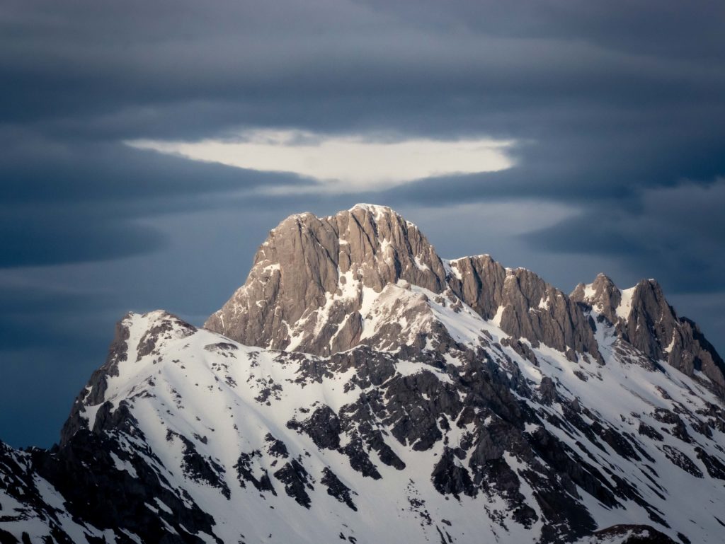 Soft light touches the rocky peaks of the Fribourg Prealps