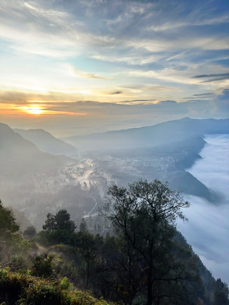 Morning mist over the Tengger Caldera viewed from Mount Bromo at sunrise