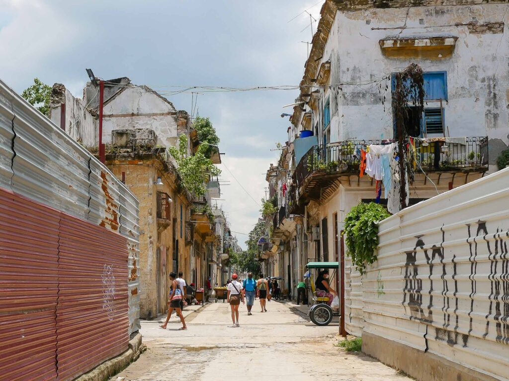 Narrow street with colorful buildings in Old Havana, Cuba