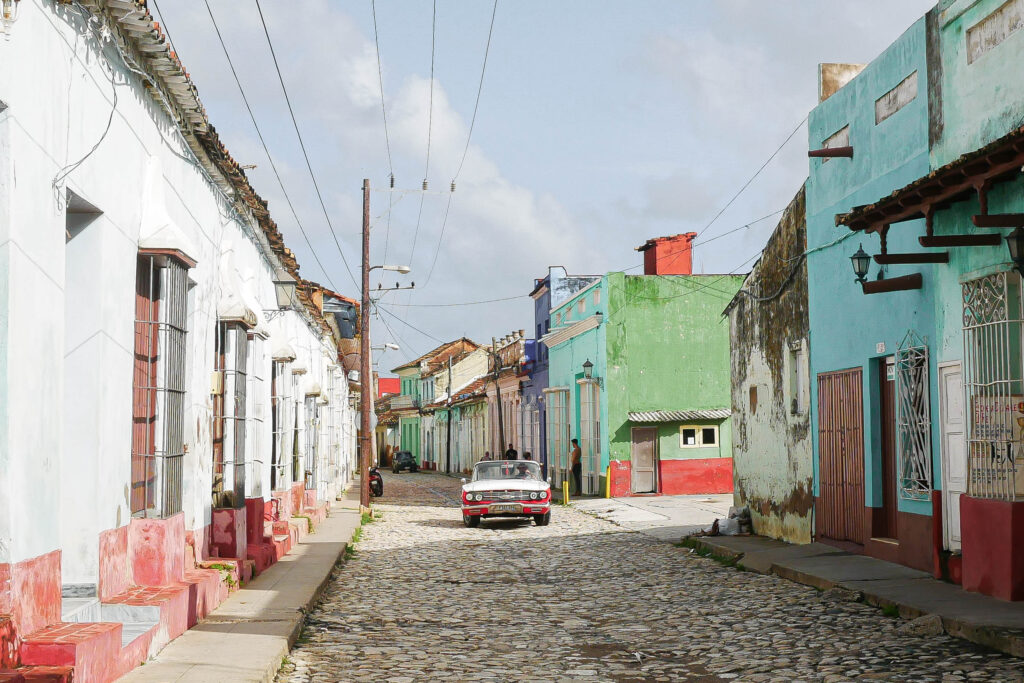 Pastel-colored street with cobblestones